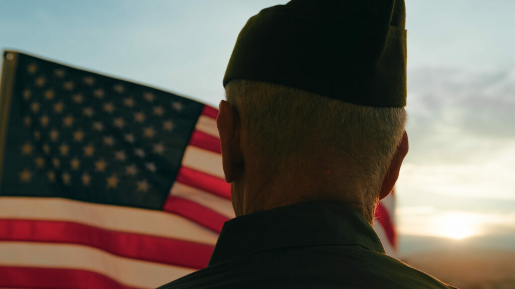 elderly-man-stand-against-american-flag-for-vetera-2024-03-05-18-03-29-utc-scaled.jpg